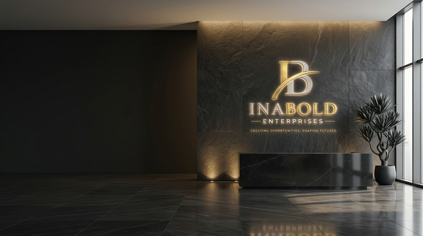 Inabold Enterprises reception lobby with the company logo lit on a dark stone feature wall above a black marble front desk